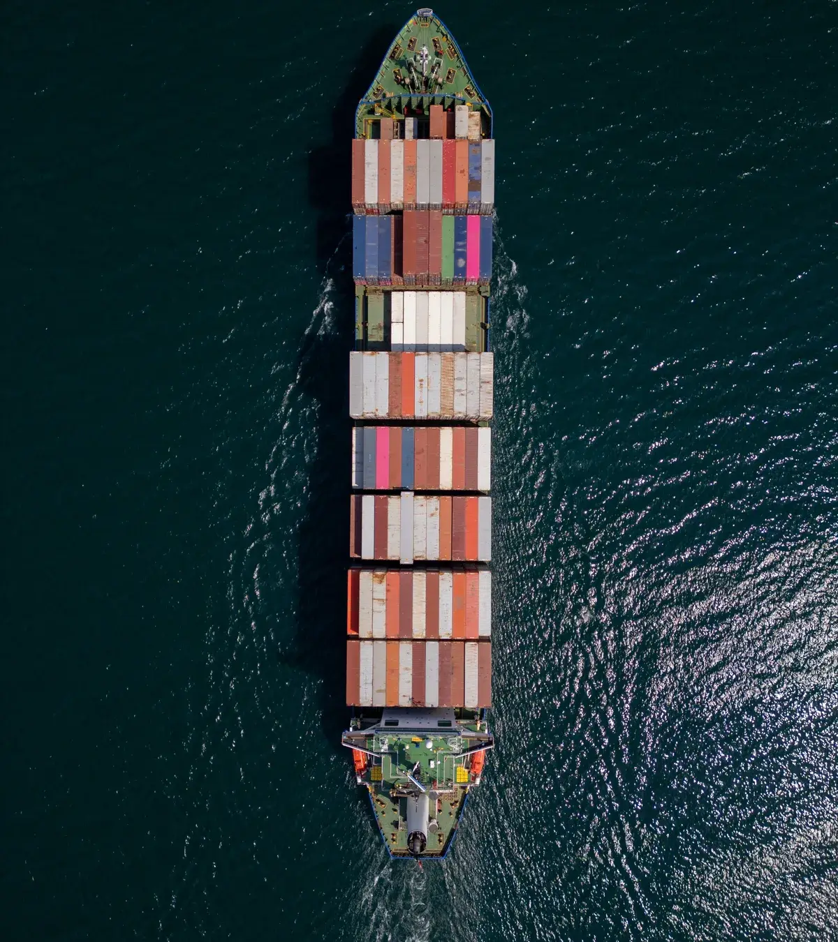 Aerial view of a fully loaded container ship at sea